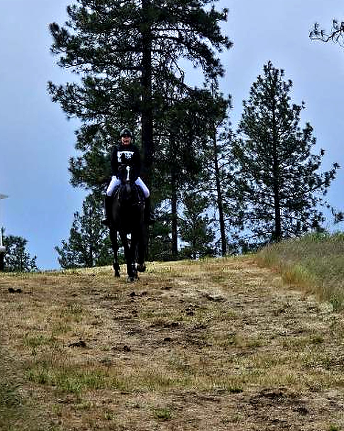 Megan Glowka on horseback on a cross-country course